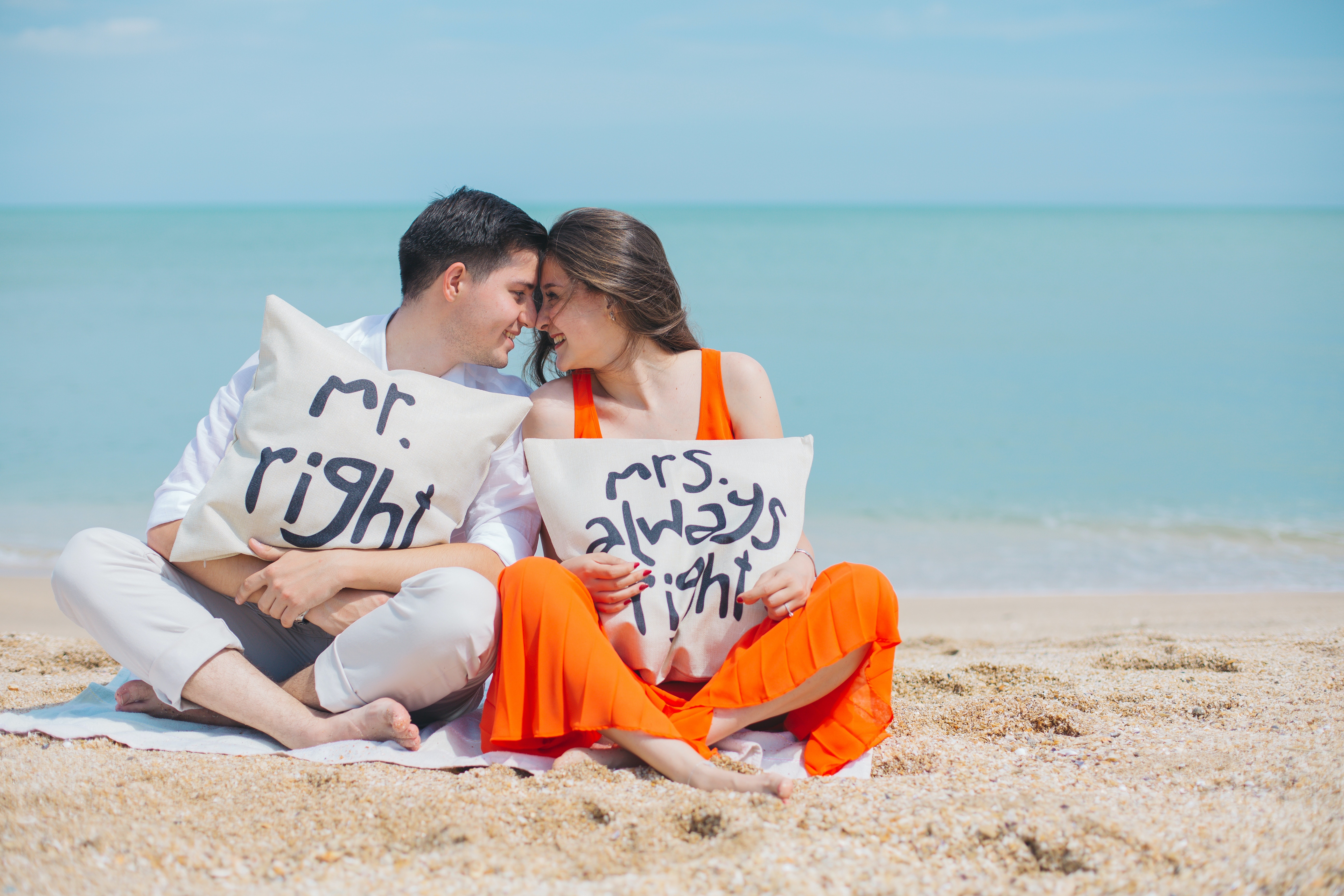 man-and-woman-wearing-cloths-sitting-on-brown-sand-near-792729